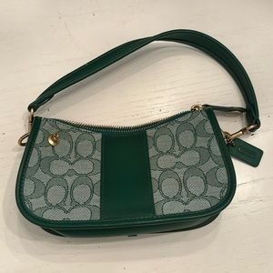 Green leather and signature fabric clutch
